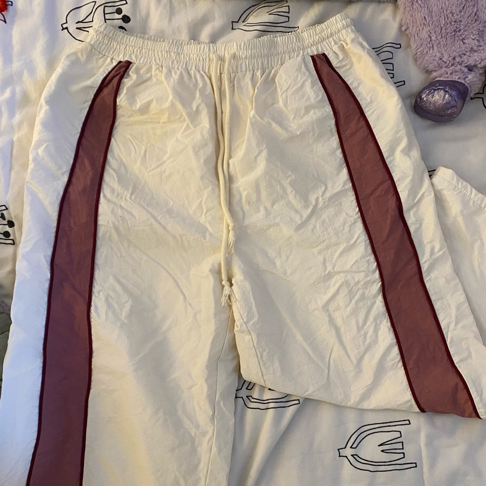 White and pink track pants